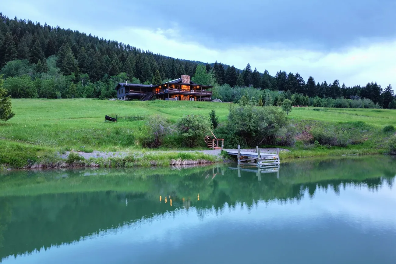 Lodge and pond at Four Peaks Ranch