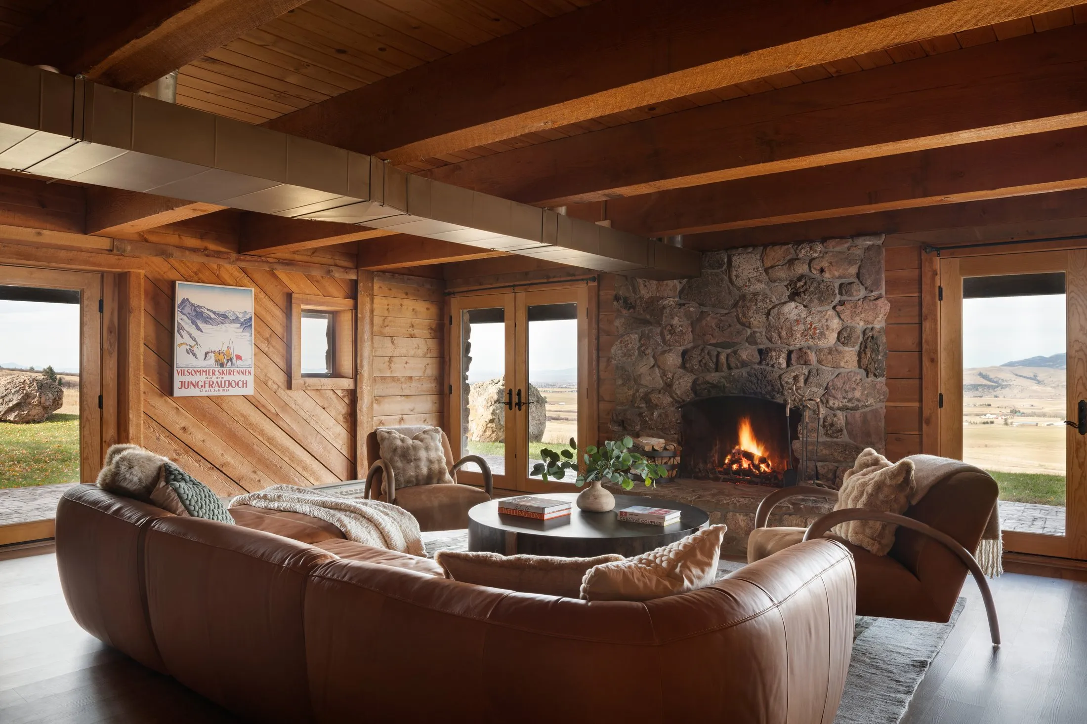 Lower-level living room with stone fireplace